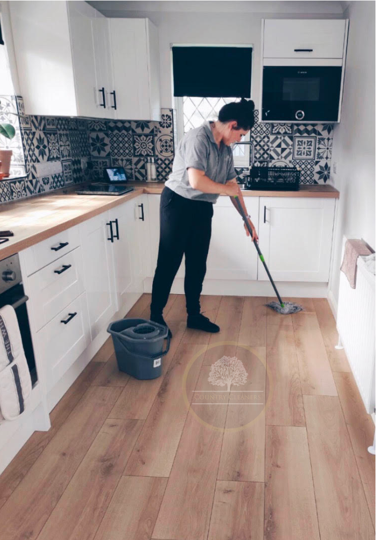 Country Cleaners staff mopping a floor in Cullompton