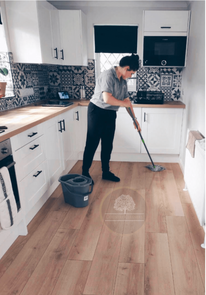 Country Cleaners staff mopping a floor in Cullompton